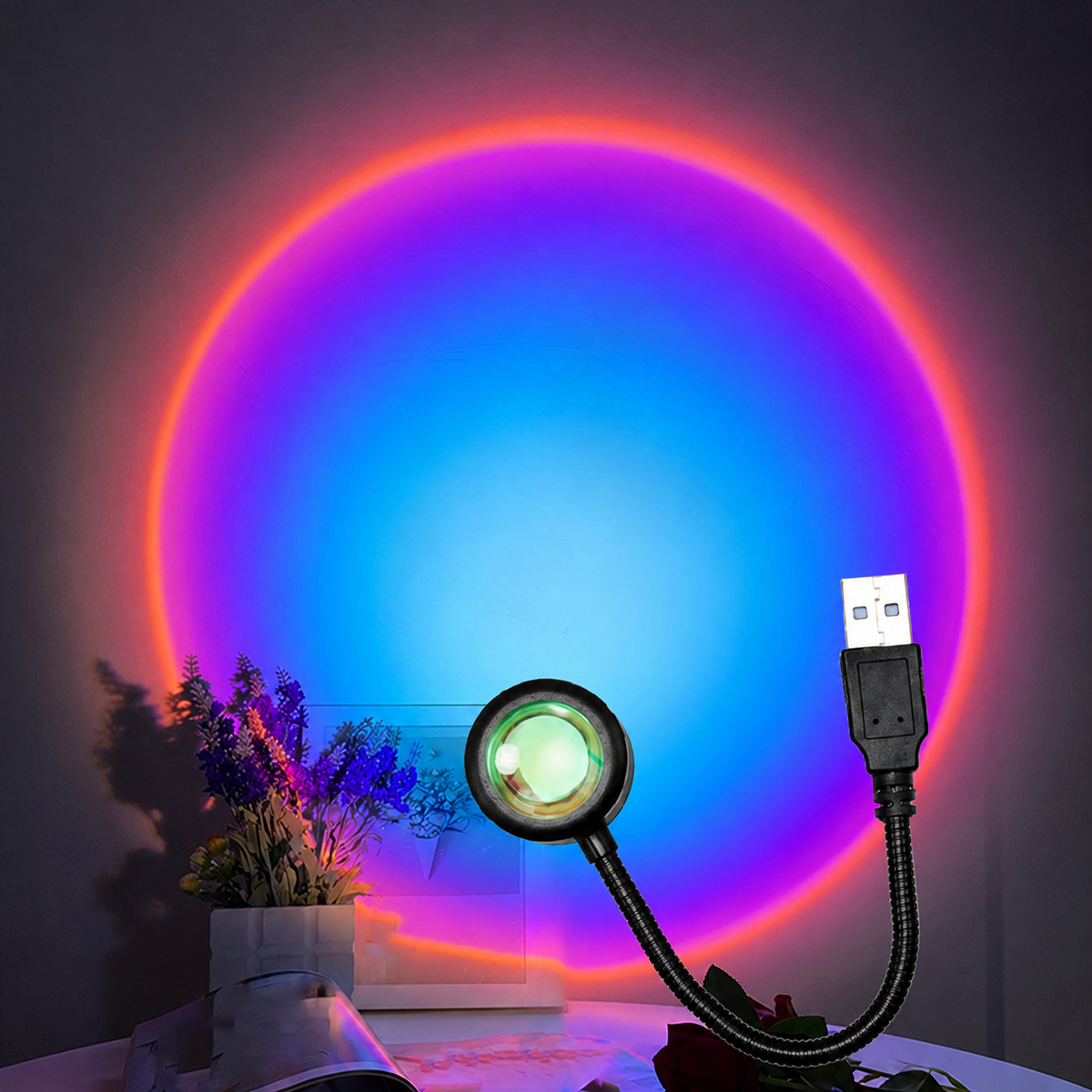 Regnbågsfärgat cirkelformat sken i blått lila rött och orange från USB-lampa