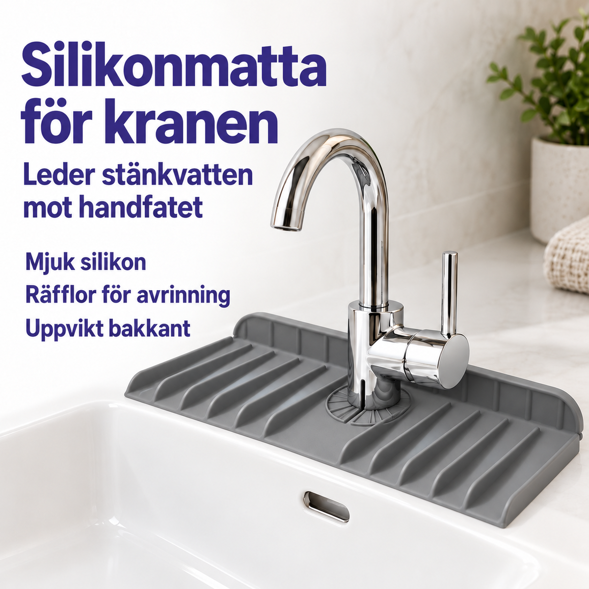 Grå silikonmatta runt kranfoten vid handfat med uppvikt bakkant