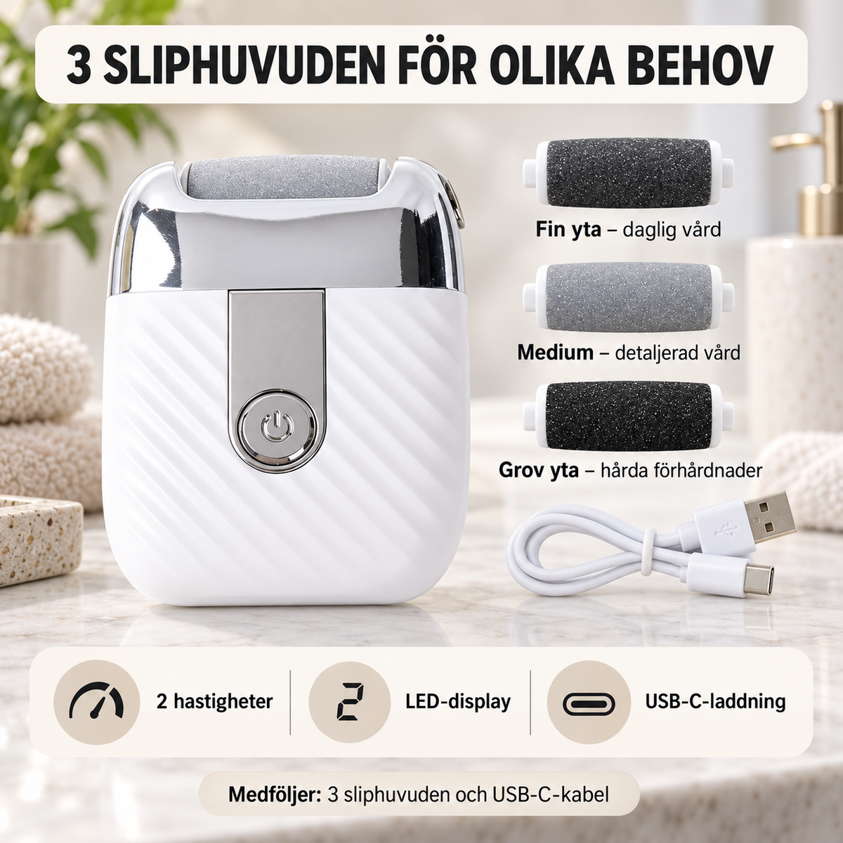 Vit elektrisk fotfil med tre sliphuvuden och USB-C-kabel på badrumsbänk